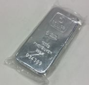 A heavy one kilo 999 standard silver bar. By Doduco.