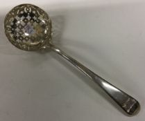 A good George III silver crested sifter spoon inscribed ‘Quid Verum Atque Decens’.