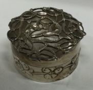 An ornate pierced silver box. London 1910. By William Comyns.