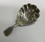 A George III fluted silver caddy spoon. London 1829. By Thomas Edwards.