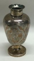 A small tapering Chinese silver vase.