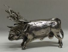 A 19th Century Continental silver toothpick holder in the form of a cow.