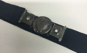 An Arts and Crafts silver jewelled belt.