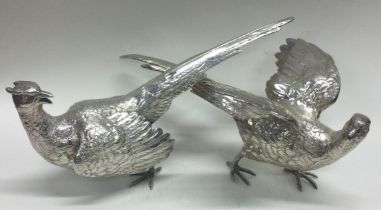 A fine and heavy pair of cast silver pheasants. London 1971.