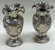 CHESTER: A pair of ornate Victorian silver vases.