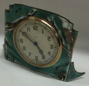 A heavy silver and enamelled Art Deco desk clock.