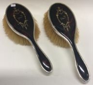 A pair of silver and tortoiseshell brushes. 1928.