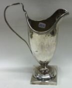 An 18th Century George III bright-cut silver jug. London. Circa 1780.