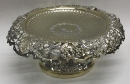 A fine quality Victorian silver gilt sweet dish decorated with figures and foliage. London. By JHC.