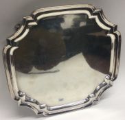 A large square silver salver with cut corners. Sheffield.