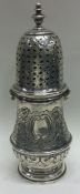 An early Queen Anne silver caster with bayonet fitting. Circa 1710.