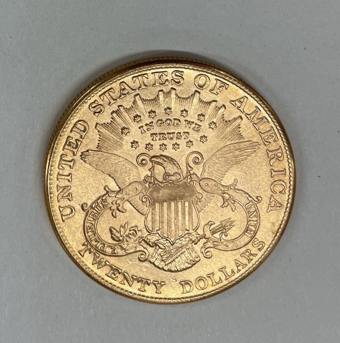 A USA Liberty head twenty dollar coin.