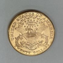 A USA Liberty head twenty dollar coin.