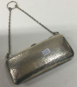 A silver purse with hammered decoration. London 1902. By Thornhill & Co.