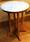 A small reproduction marble top pedestal table.