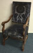 A good Continental carved armchair with lion mask