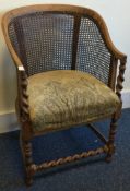 A barley twist cane back conservatory chair.