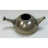 A silver toy pan with spout.