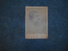 BOOKS: RUDYARD KIPLING: A faintly signed photograph reproduction of a drawing of Rudyard Kipling.