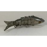 A silver articulated figure of a fish.