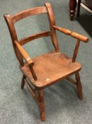 A small Antique child's chair. Est. £30 - £50.