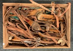 A large box containing vintage ice skates.