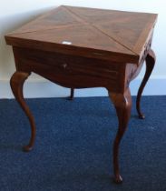 A large carved hardwood envelope card table.