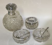 A silver hobnail cut scent bottle together with a pair of silver mounted salts.
