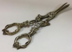 A heavy pair of Victorian grape scissors with vine decoration.