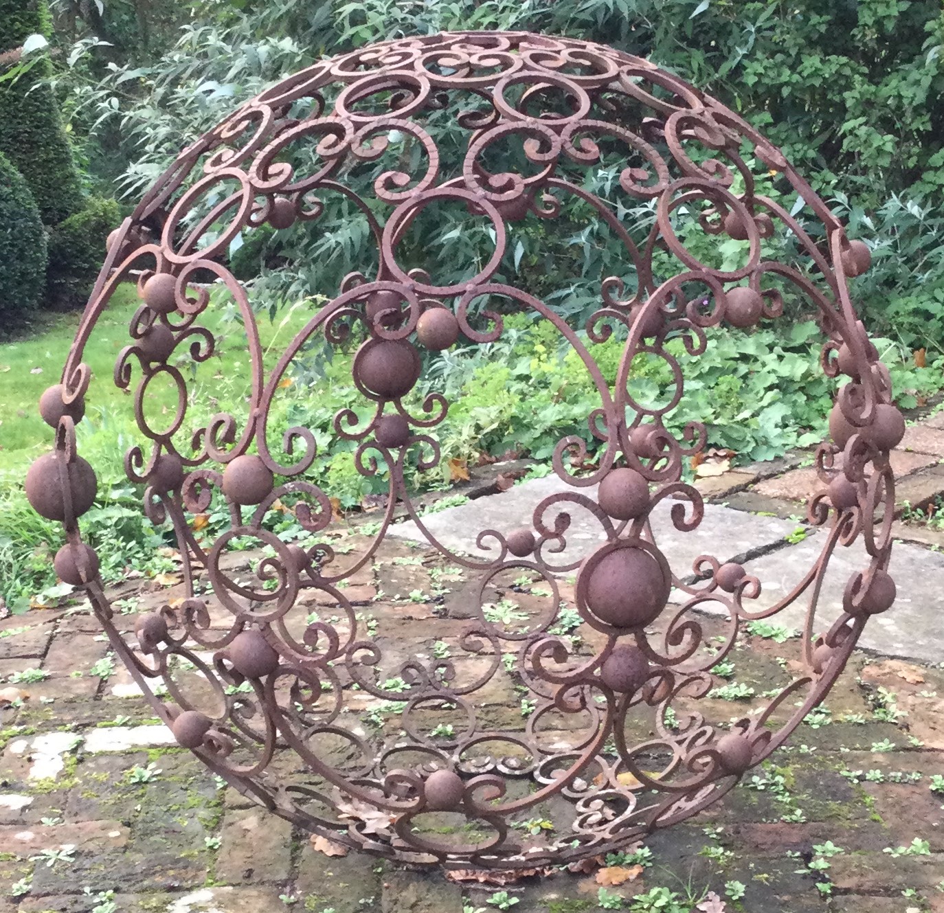 A large cast iron centrepiece with scroll decoration.