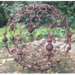 A large cast iron centrepiece with scroll decoration.