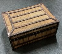 An unusual cane hinged top box.