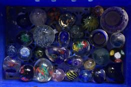A box containing paper weights.