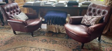 A good matched pair of button back smokers chairs.