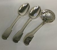 A pair of fiddle pattern dessert spoons together with a sifter spoon.