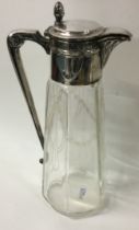 A large Continental silver and cut glass claret jug.