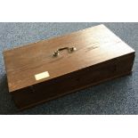 A small oak box with hinged top.