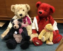 Two Deans teddy bears together with two other bears.