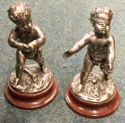 LOUIS KLEY: (French, 1833 - 1911): A pair of silvered bronze children on circular marble socl