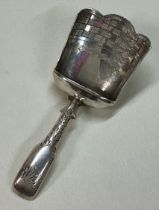 A Georgian silver caddy spoon.