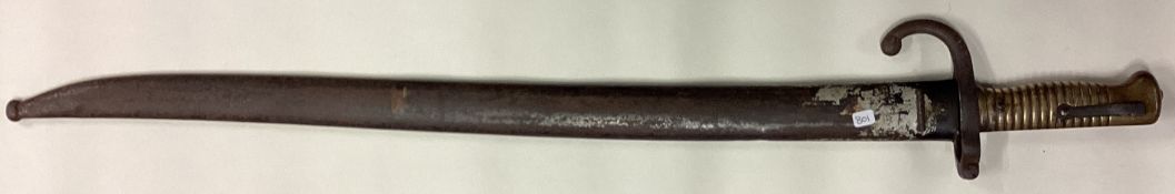 A brass mounted bayonet with sheath.
