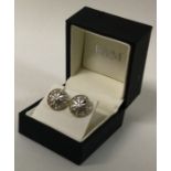 A pair of unusual two colour gold cufflinks in the form of dart boards with diamond mounts.