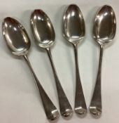 A set of four 18th Century silver shell back teaspoons.