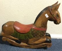 A Continental painted rocking horse.
