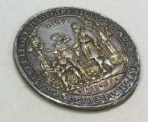 A 17th Century silver medallion.