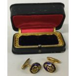 A pair of gold plated military cufflinks contained within a fitted box.