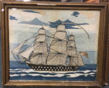 A good framed and glazed tapestry of a boat under sail.