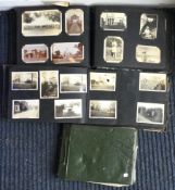 A group of three postcard albums.