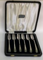 A boxed set of six silver cake forks.