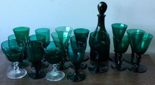 A good collection of antique green glass.
